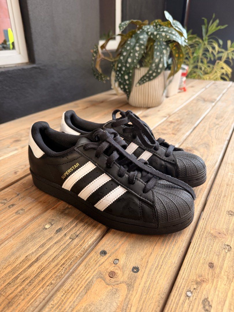Adidas Superstar Black White Sneakers (Category: Sneakers) located in Tuguegarao City. Submitted by joysmithznjo (Listing ID 1463200813, Image 1). Description: - Classic Adidas Superstar sneakers - Color: Black with white stripes and heel tab - Iconic shell toe design - Black laces - Ideal for everyday wear - A staple for any sneaker collection.