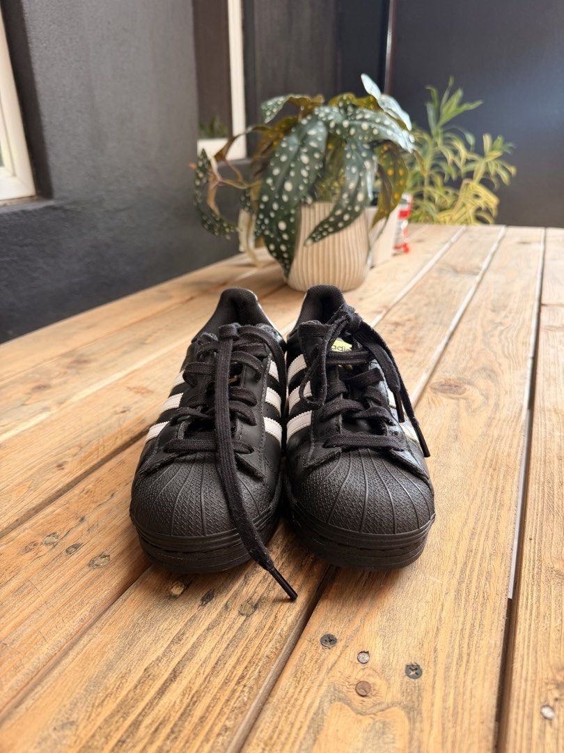 Adidas Superstar Black White Sneakers (Category: Sneakers) located in Tuguegarao City. Submitted by joysmithznjo (Listing ID 1463200813, Image 2). Description: - Classic Adidas Superstar sneakers - Color: Black with white stripes and heel tab - Iconic shell toe design - Black laces - Ideal for everyday wear - A staple for any sneaker collection.