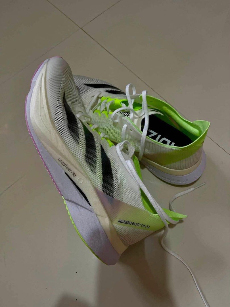 ADIZERO BOSTON 12 (Category: Other Sports Equipment and Supplies) located in Manila. Submitted by katlitter (Listing ID 1463226894, Image 3). Description: FOR SALE ORIGINAL ADIZERO BOSTON 12 Color: Cloud White / Core Black / Green Spark Size: US-8 / UK-7 1/2 / FR-41 1/3 / JP-260 / CHN-255 RFS: Wrong size kaya hindi magamit. Location: Balanga, Bataan - Never worn, brand new. - Bought on Aug. 8, 2026, arrived on Aug. 24, 2026. - Walang box kasi pad