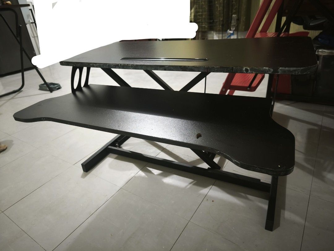 Adjustable Standing Desk Converter Workstation Riser (Category: Office Furniture & Fixtures) located in Caloocan City. Submitted by yennarz (Listing ID 1463197775, Image 2). Description: 3 years old, still works great and rises up smoothly. Can be used for desktop screen and keyboard. Visible scratches from use. For delivery via Lalamove Sedan only. 80 cm W, 45 cm L, 49cm H (fully extended).