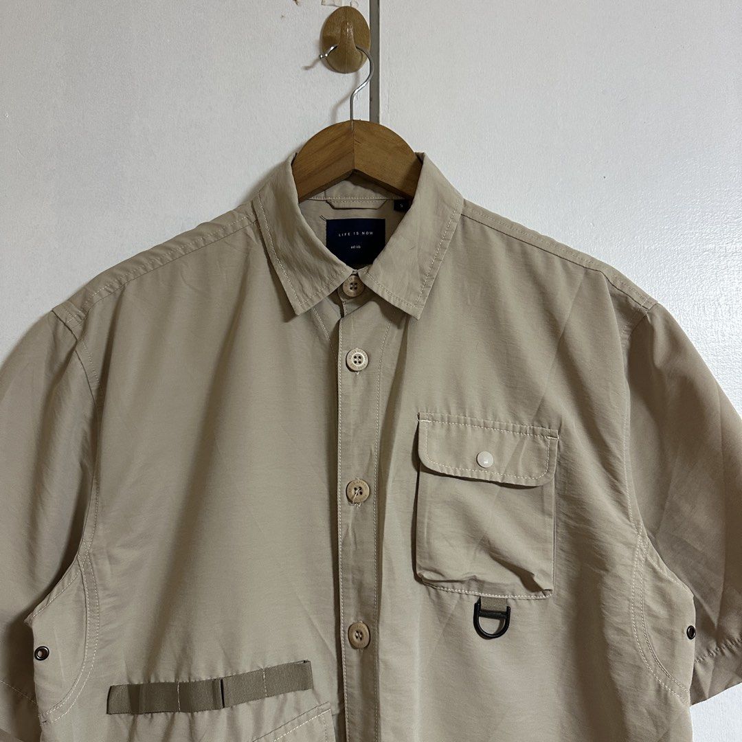 AD-LIB Multi-pocket Utility Shirt - Beige (Category: Tshirts & Polo Shirts ) located in General Trias. Submitted by seconddegreeco (Listing ID 1463277167, Image 2). Description: AD-LIB Multi-pocket Outdoor Utility Shirt - Beige Small beat fit medium 27-28 length 22 width Excellent ‼️ No issue.