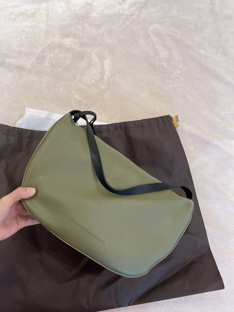 Adolfo Dominguez Green Leather Shoulder Bag (Category: Shoulder Bags) located in Muntinlupa City. Submitted by annalau19 (Listing ID 1463197774, Image 3). Description: - Adolfo Dominguez shoulder bag - Chic green color - Features a stylish black strap - Comes with original dust bag - Ideal for everyday wear.