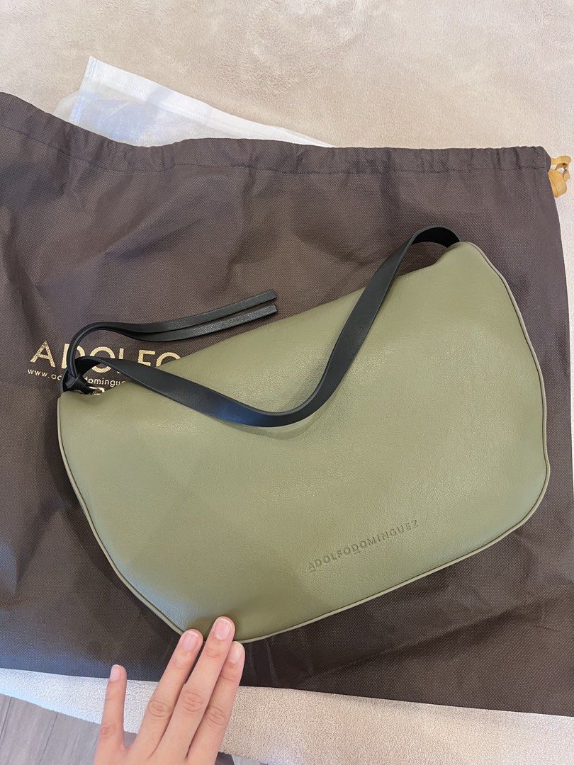 Adolfo Dominguez Green Leather Shoulder Bag (Category: Shoulder Bags) located in Muntinlupa City. Submitted by annalau19 (Listing ID 1463197774, Image 2). Description: - Adolfo Dominguez shoulder bag - Chic green color - Features a stylish black strap - Comes with original dust bag - Ideal for everyday wear.
