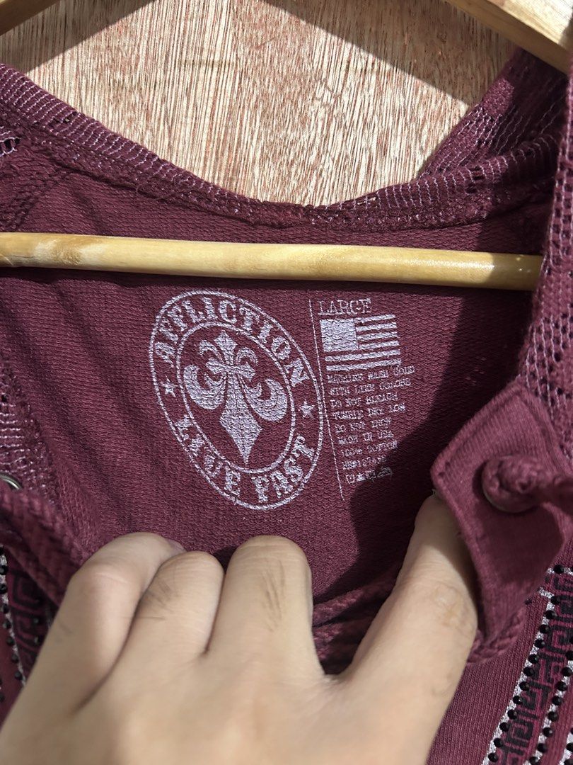 Affliction "Live Fast" Eagle Graphic Lace-Up Hoodie (Category: Coats, Jackets and Outerwear) located in Davao. Submitted by orbetaarch23339 (Listing ID 1463310567, Image 3). Description: - Brand: Affliction - Color: Maroon - Size: Large - Design: Eagle graphic with 'Live Fast' text - Features: Lace-up neckline, mesh sleeves, mesh hood - Origin: Made in USA - Occasion: Great for casual wear.