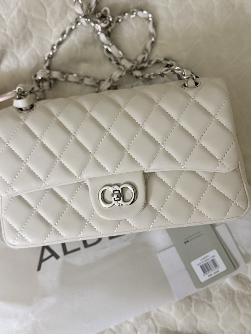 ALBERTO Off White Quilted Chain Shoulder Bag (Category: Shoulder Bags) located in Quezon City. Submitted by unforgettwble. (Listing ID 1463301890, Image 1). Description: - White quilted shoulder bag - Brand: ALBERTO - Silver chain strap - Cute clasp closure - Comes with original tag - Versatile for going out or everyday use.