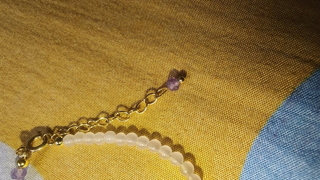 Amethyst Beaded Bracelet (Category: Bracelets) located in Manila. Submitted by rare.elieli (Listing ID 1463171147, Image 3). Description: - Cute beaded bracelet - Half light purple amethyst stones, half white stones - Gold-colored clasp and extender chain - Small amethyst charm on extender - Ideal for everyday wear or layering.