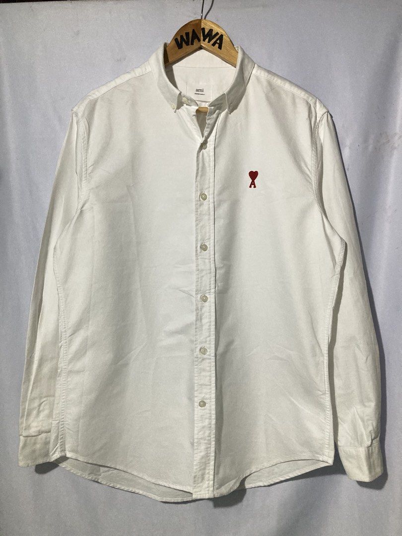 AMI BUTTONNDOWN POLO (Category: Luxury Apparel) located in Naga. Submitted by wwy3ips (Listing ID 1463239684, Image 1). Description: AMI BUTTONDOWN POLO SIZE 40 ON TAG - 22 WIDTH - 29 LENGTH - EXCELLENT CONDITION - 9.5 COLOR RATE - ISSUE SEE LAST PIC PINHOLE .