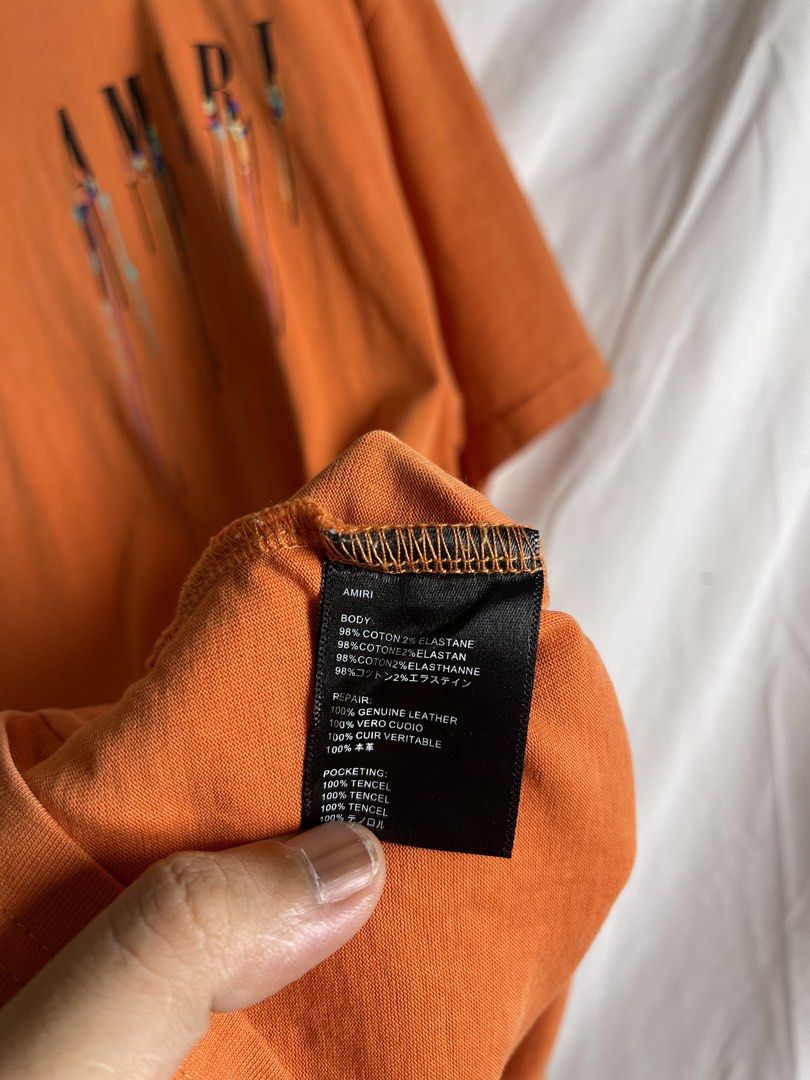 AMIRI Orange Drip Logo T-Shirt (Category: Tshirts & Polo Shirts ) located in Manila. Submitted by noahcastilljos363 (Listing ID 1463211754, Image 2). Description: - Orange AMIRI T-shirt - Signature drip logo on front and back - Made from a comfortable cotton blend - Ideal for casual outfits.