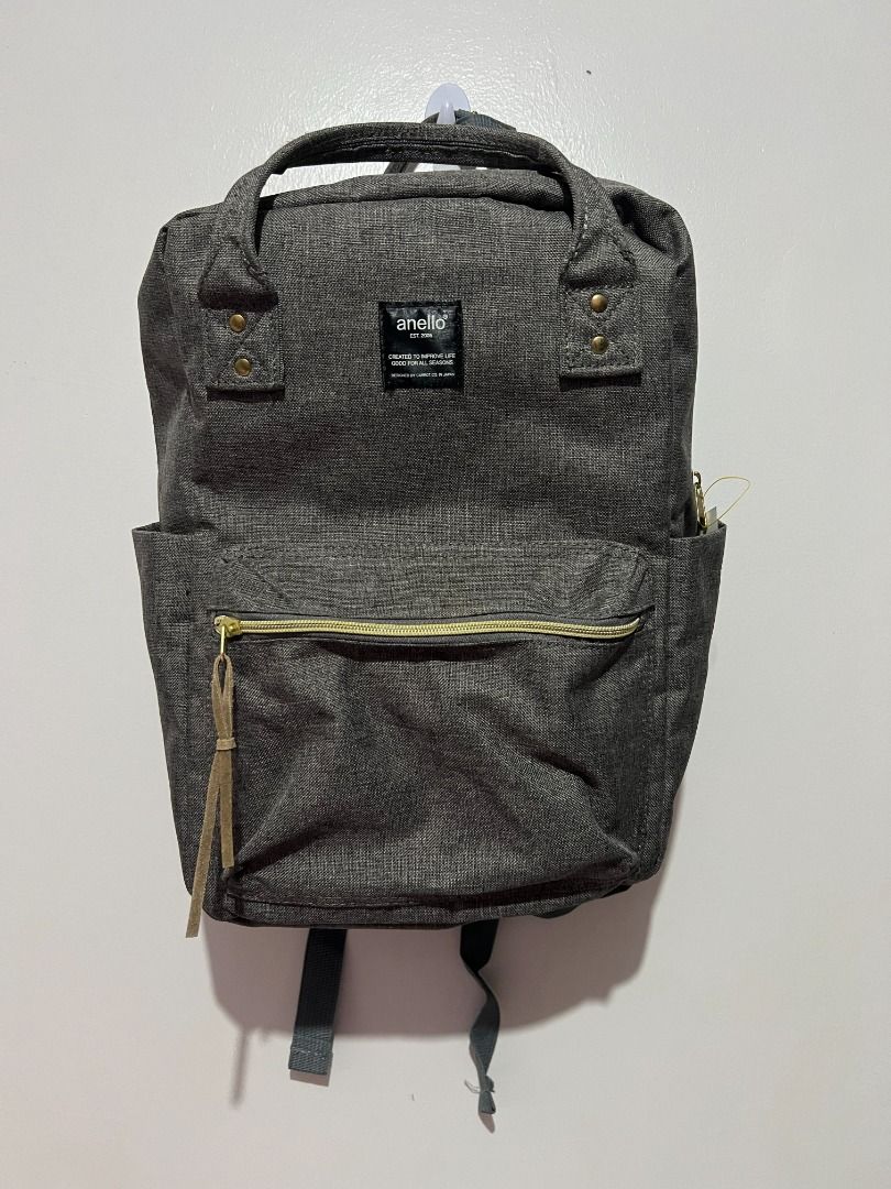 Anello Classic Canvas Backpack (Grey) (Category: Backpacks) located in Caloocan City. Submitted by jpnusapasabuyfindsdvo (Listing ID 1463281644, Image 2). Description: Upgrade your daily commute or casual travels with this stylish and highly functional Anello classic backpack. Known for its signature wide-opening main compartment and sturdy wireframe design, this bag features a spacious interior, convenient side bottle pockets, a front zippered c