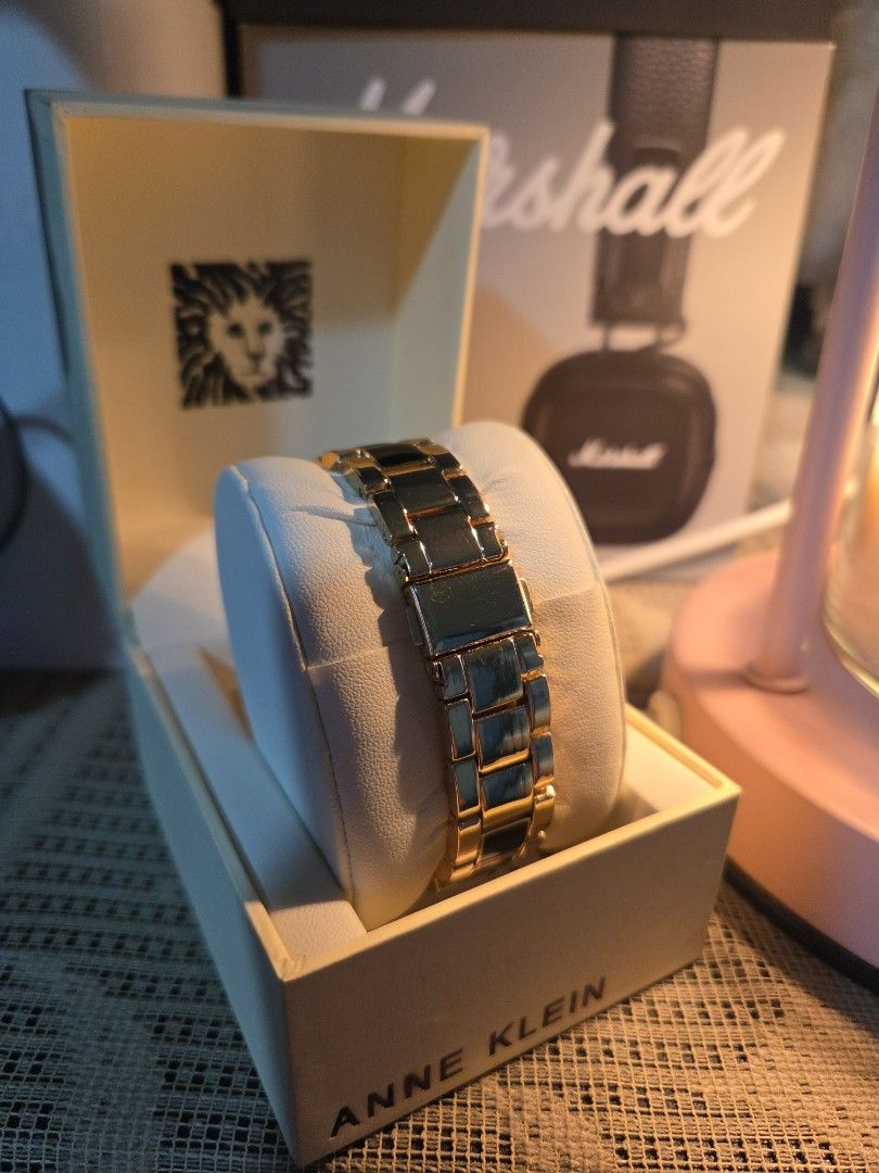 Anne Klein (Category: Women's Watches) located in Manila. Submitted by AA8888 (Listing ID 1463182922, Image 3). Description: - Elegant Gold and Black Anne Klein Watch - Classic design featuring Roman numerals on the face - Includes original box - Versatile for both everyday wear and special occasions - A truly timeless accessory Pick up or lalamove .