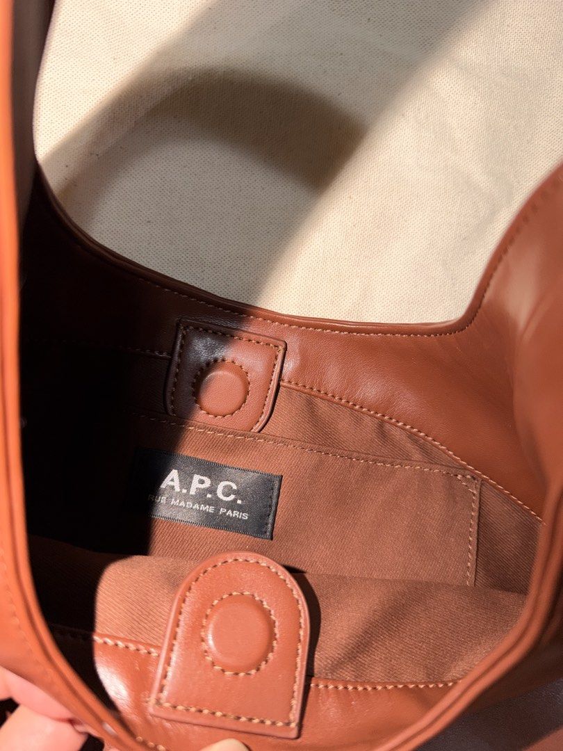 A.P.C. Brown Leather Shoulder Bag (Category: Luxury Bags & Wallets) located in Las Pinas. Submitted by twiceloved24 (Listing ID 1463260971, Image 3). Description: - Features iconic A.P.C. logo on the front - Interior tag reads 'A.P.C. Rue Madame Paris' - Secure snap closure - Comes with original dust bag - Ideal for everyday wear, stylish and practical.