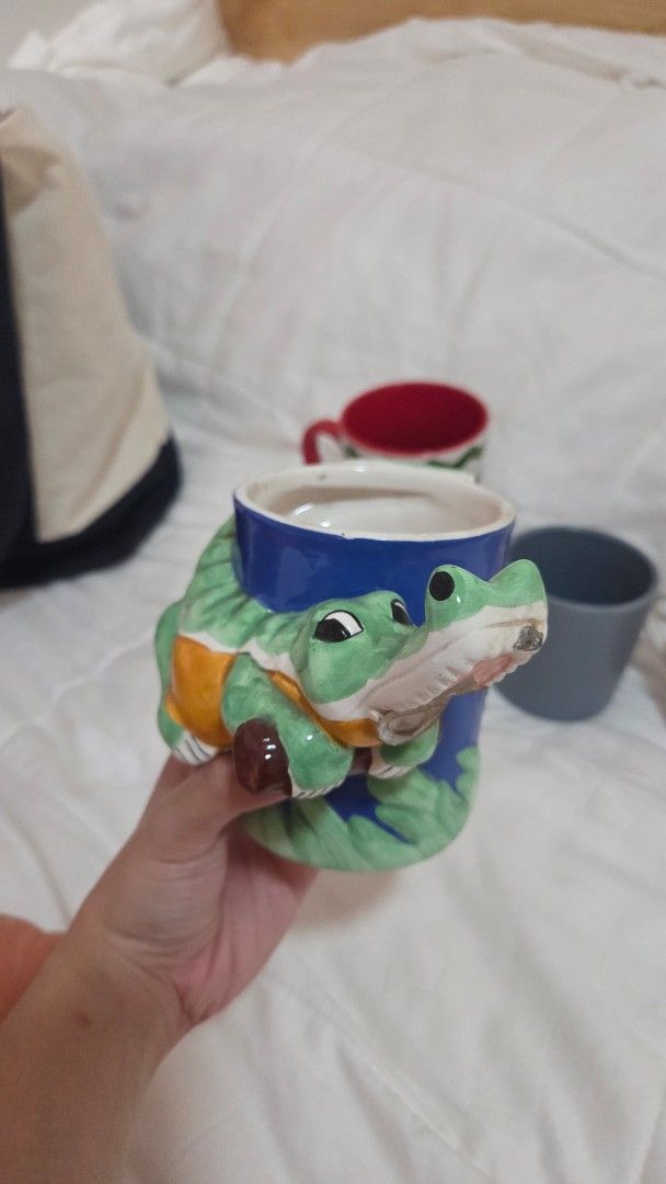 Assorted Ceramic Mugs SUPER SALE (Category: Coffee & Tea Tableware) located in Bacoor. Submitted by nahalili1 (Listing ID 1463185591, Image 3). Description: Bundle of 5 preloved mugs - Vintage crocodile mug - "Tis the season" Christmas mug - Solid color blue/cobalt mug - Uniqlo store opening mug - Chibi DC Justice League mug RFS: downsizing my collection - Some mugs have a name tag at the bottom but it can be washed off - Price negotiable.
