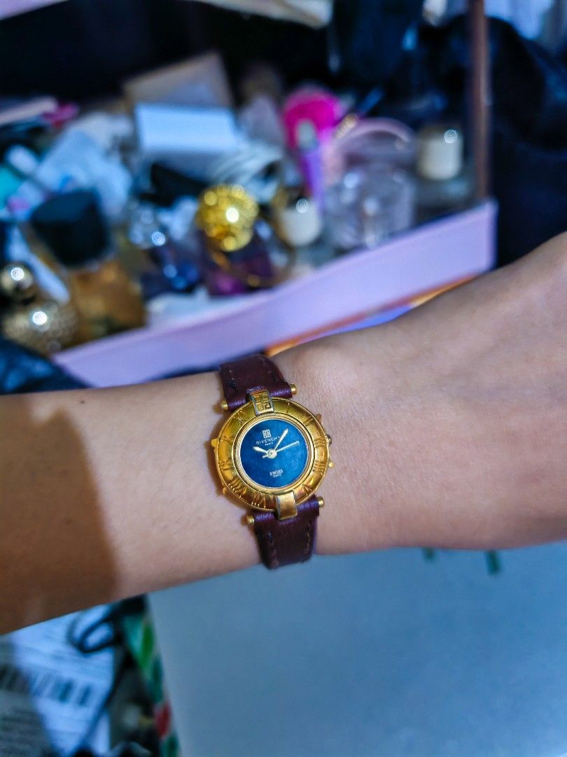 Auth Givenchy Paris Swiss Watch (Category: Women's Watches) located in Taguig. Submitted by mystuff4youph (Listing ID 1463232688, Image 2). Description: - Gold tone Givenchy watch - Dark blue face with Roman numeral hour markers - Dark brown leather strap - Swiss made quartz movement - Classic and in good working condition - Battery working - Minimal sign of use and slight fading but not noticeable.