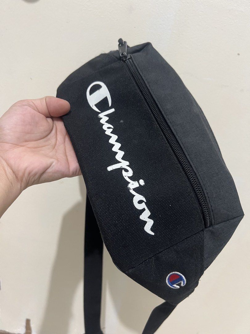 Authentic Champion Prime Sling / Waist Pack (Black) (Category: Belt bags, Clutches and Pouches) located in Noveleta. Submitted by twincess17 (Listing ID 1463270306, Image 2). Description: Selling my authentic Champion Sling Bag. Perfect for daily use, commuting, or travel. Fits your phone, wallet, keys, and other essentials comfortably. Product Details:Brand: ChampionColor: Black with white script logo and blue interior lining Condition: 7/10 (Go