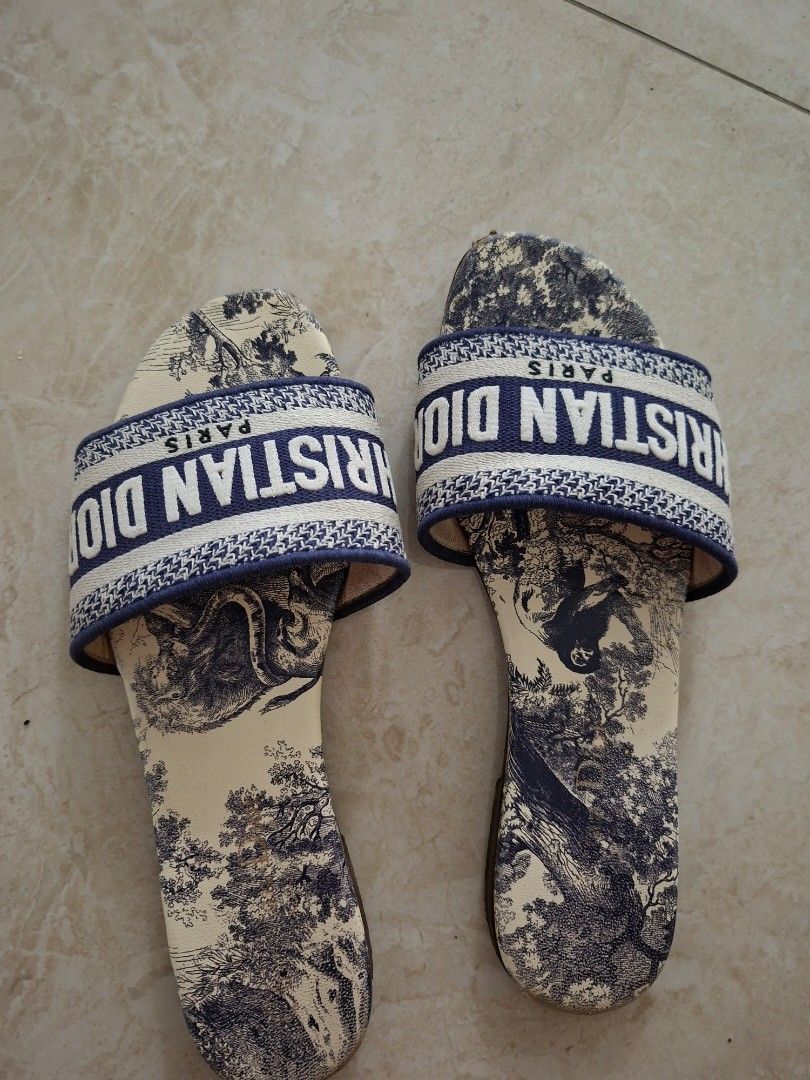Authentic Christian Dior Paris Slides (Category: Sneakers & Footwear) located in Angeles City. Submitted by miho066_ (Listing ID 1463130673, Image 2). Description: - Authentic Christian Dior Paris slides - Classic logo strap - Beautiful Toile de Jouy print on footbed and sole - Comfortable slip-on design - Ideal for casual wear and lounging - A true statement piece.