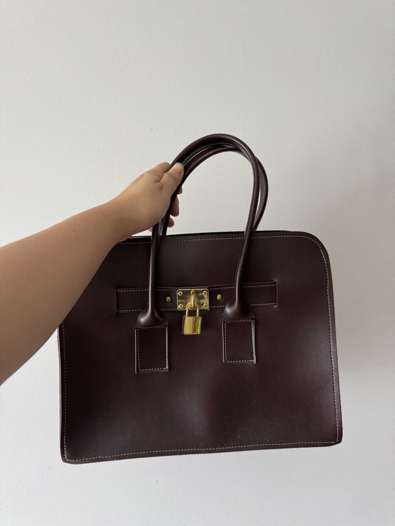 Authentic leather work bag from Thailand (Category: Tote Bags) located in Caloocan City. Submitted by alyyssssa (Listing ID 1463145600, Image 1). Description: Brown leather work bag from thailand Rfs: decided to use a backpack instead for work. .