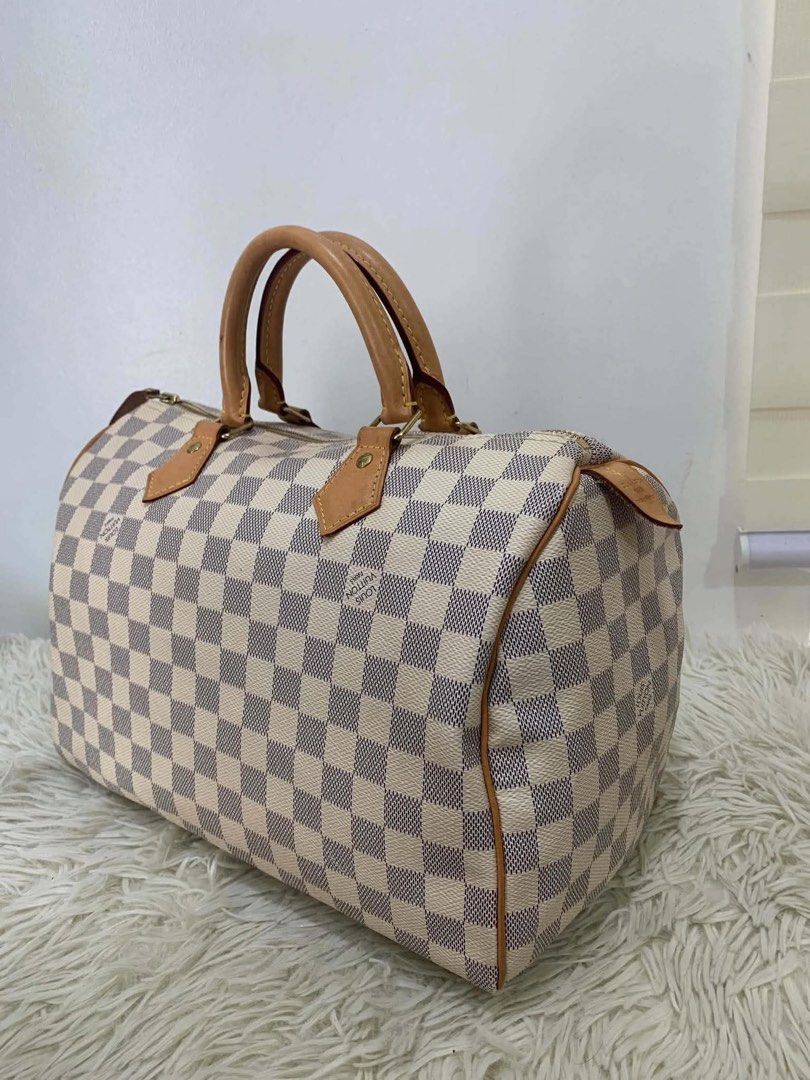 Authentic Louis Vuitton (Category: Luxury Bags & Wallets) located in Manila. Submitted by chloe_luxuries (Listing ID 1463302219, Image 2). Description: Guaranteed Original Louis Vuitton Speedy 30 Azur Still in good condition Comes with lockset and dustbag Pm for more details.