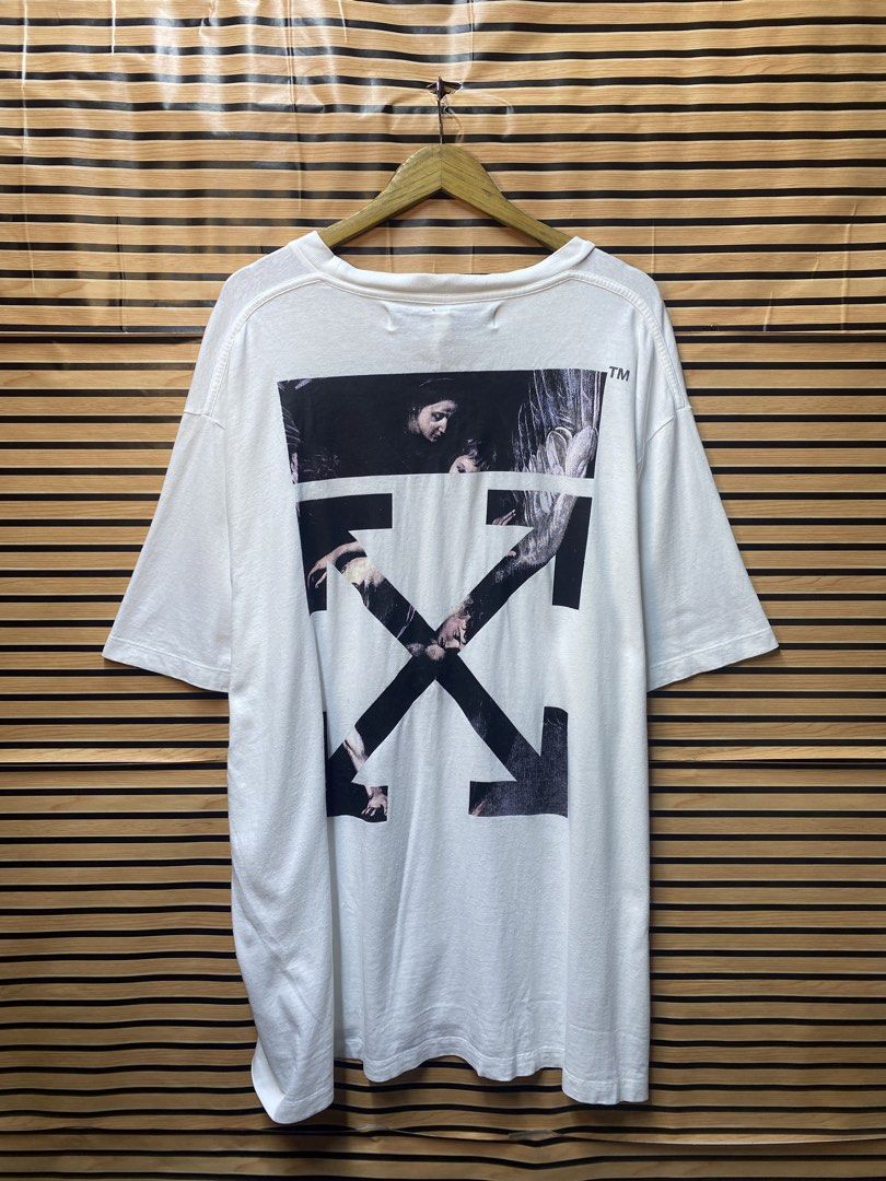 Authentic Off-White Caravaggio Arrows tee (Category: Tshirts & Polo Shirts ) located in Makati City. Submitted by drip.poww (Listing ID 1463292626, Image 1). Description: - Authentic Off White - Color: White - Size: XL - Dimes: 25x32 - Authentic - Excellent condition - Need wash, fresh from bale - Material: 100% Cotton Please don’t expect too much—these are thrifted (ukay) items. 😊 !!STILL NEGOTIABLE!!.