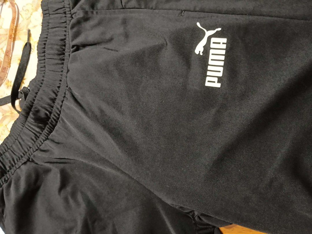 Authentic Puma Dark Blue Jogger Pants (Category: Joggers) located in Manila. Submitted by practicalitynerd (Listing ID 1463226037, Image 2). Description: - Authentic Puma jogger pants - Color: Dark Blue - Waist (unstretched): Approx. 13 inches across - Total Length: Approx. 35 inches - Leg Cuff: Approx. 7 inches across - Ideal for casual wear or workouts - Please check measurements before purchasing.