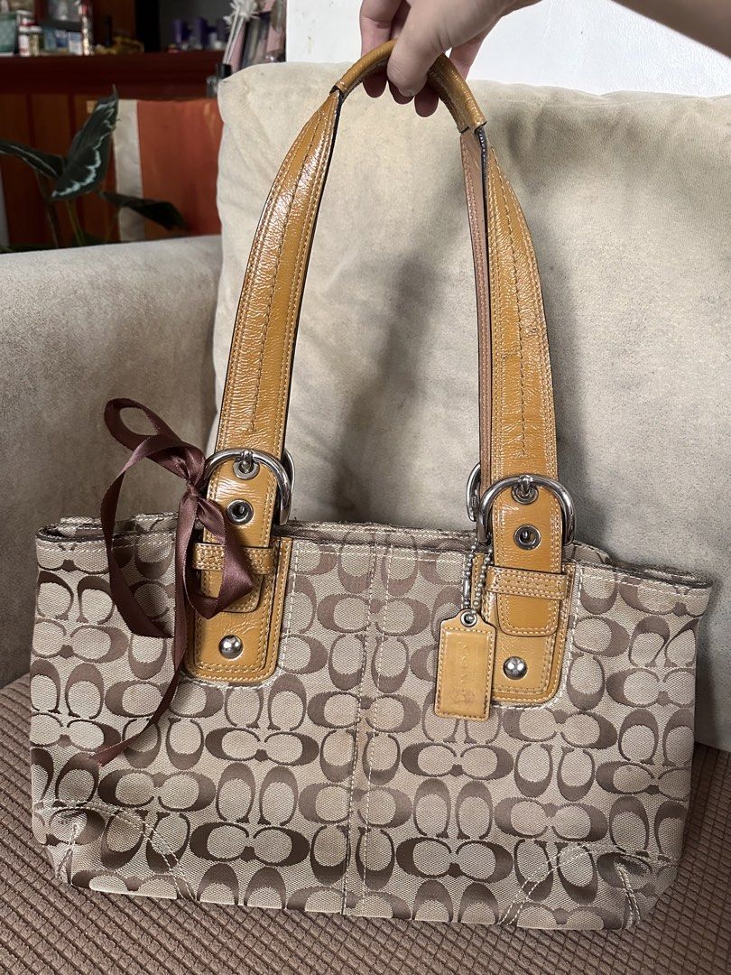 Authentic Vintage Coach Soho Pleated (Category: Luxury Bags & Wallets) located in Manila. Submitted by happyocean22 (Listing ID 1463272383, Image 1). Description: - Stylish brown tote bag - Durable canvas material - Spacious interior - Classic and versatile design.