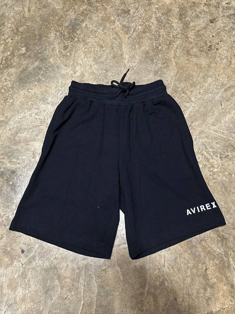 Avirex Black Athletic Sweat Shorts (Category: Shorts) located in Marikina City. Submitted by plus6three (Listing ID 1463178169, Image 3). Description: Avirex Black Athletic Sweat Shorts Size: Small Price: 600php Color: Black with white graphic text Design Features: Minimalist "AVIREX" branding on the lower left leg, comfortable elastic waistband, and an adjustable drawstring for a customizable fit. Material: Soft, breathable premium cotton-blend 