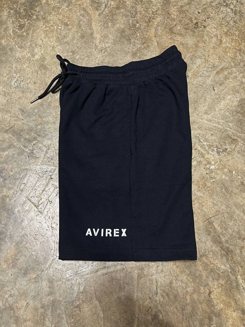 Avirex Black Athletic Sweat Shorts (Category: Shorts) located in Marikina City. Submitted by plus6three (Listing ID 1463178169, Image 1). Description: Avirex Black Athletic Sweat Shorts Size: Small Price: 600php Color: Black with white graphic text Design Features: Minimalist "AVIREX" branding on the lower left leg, comfortable elastic waistband, and an adjustable drawstring for a customizable fit. Material: Soft, breathable premium cotton-blend 