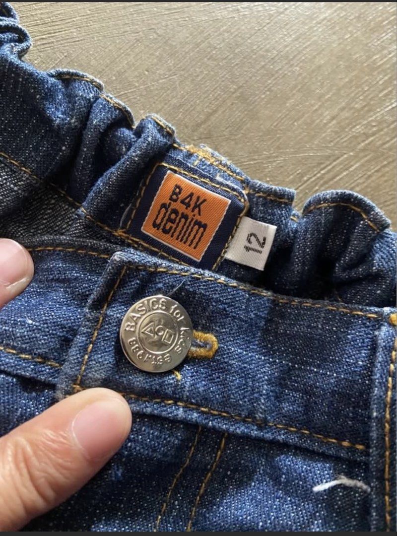 Basic kids Denim Jeans Size 12 (Category: Babies & Kids Fashion) located in Taguig. Submitted by macxdinglas (Listing ID 1463170063, Image 2). Description: - Dark wash denim jeans - Elasticated waistband with ruffled detail - Button and zip closure - Two front pockets - Classic five-pocket styling - Ideal for everyday wear.