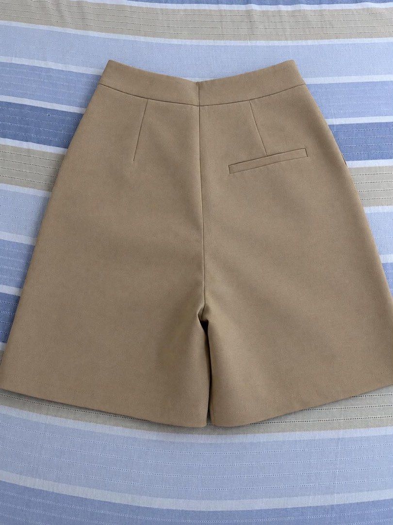 Beige high-waisted tailored shorts (Category: Shorts) located in Manila. Submitted by _auraq11 (Listing ID 1463193389, Image 3). Description: features an asymmetrical crossover front detail 12 inch waist 18 inch long.