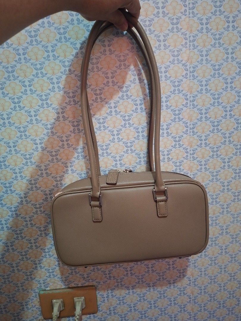 Beige Structured Handbag with Double Handles (Category: Shoulder Bags) located in Cainta. Submitted by missbeanboss77 (Listing ID 1463210701, Image 2). Description: - Structured beige handbag - Two top handles - Zipper closure on top - Interior zippered pocket - Interior slip pocket - Clean inside and out - Ideal size for daily essentials.