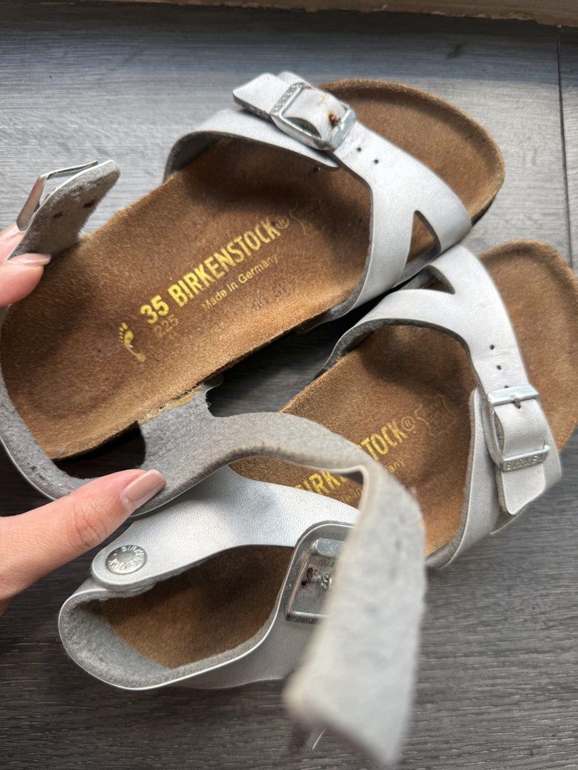 Birkenstock Silver Sandals Size 35 (Category: Flats & Sandals) located in San Fernando. Submitted by binggowtiiiii (Listing ID 1463169129, Image 1). Description: - Silver Birkenstock sandals - Size 35 - Made in Germany - Genuine cork footbed - Adjustable straps with buckles - Soles show some wear - Ideal for everyday wear Used twice only. Kept too long hence, there's a minor rust in one of the buckle. Needs cleaning. .