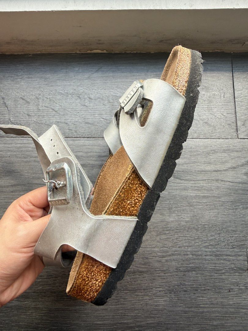 Birkenstock Silver Sandals Size 35 (Category: Flats & Sandals) located in San Fernando. Submitted by binggowtiiiii (Listing ID 1463169129, Image 3). Description: - Silver Birkenstock sandals - Size 35 - Made in Germany - Genuine cork footbed - Adjustable straps with buckles - Soles show some wear - Ideal for everyday wear Used twice only. Kept too long hence, there's a minor rust in one of the buckle. Needs cleaning. .