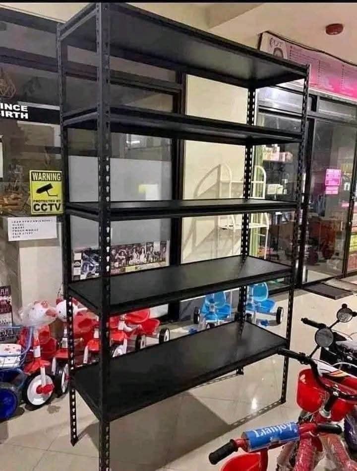 Black 5-Tier Metal Shelving Unit (Category: Shelves, Cabinets & Racks) located in Caloocan City. Submitted by swiftflower_802790 (Listing ID 1463158134, Image 1). Description: - Heavy duty metal shelving unit - 5 tiers for ample storage - Sleek black finish - Ideal for home or shop organization - Easy to assemble - Dimensions: Approx. 180cm (H) x 90cm (W) x 45cm (D) - Pick up only.