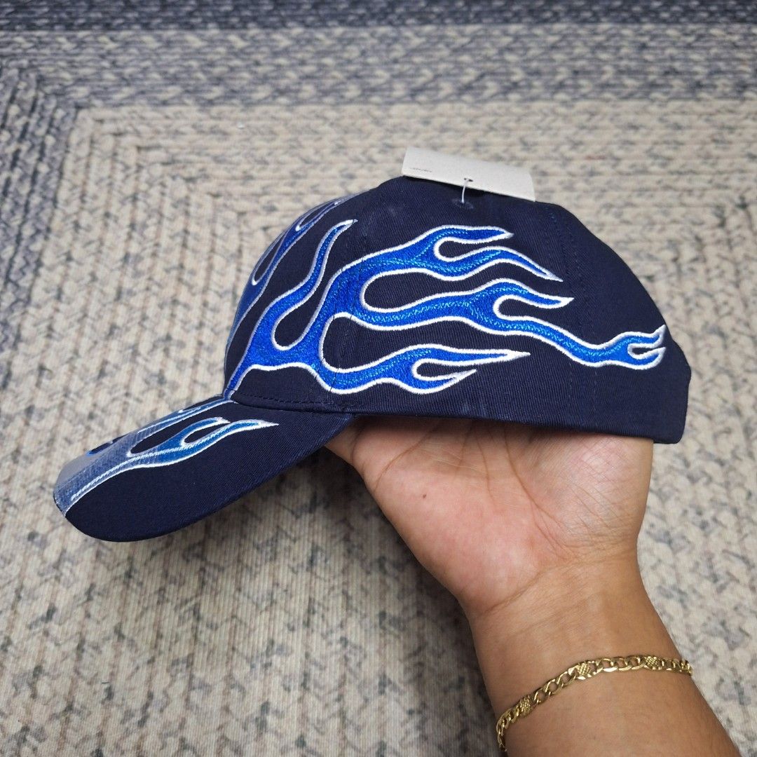 Black / Blue Flame club cap/hat by Nike (Category: Caps & Hats) located in Balagtas. Submitted by capncaps09 (Listing ID 1463284096, Image 3). Description: Black / Blue Flame club cap/hat by Nike brand new legit 100% Size: M/L bucklestrap Y2K fittings mid crown 750 only.