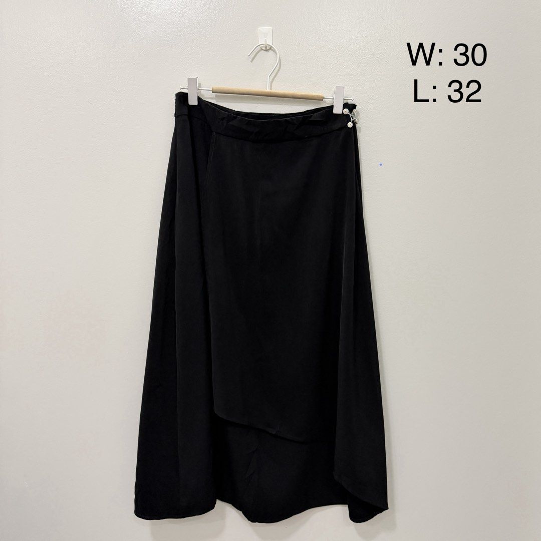 Black Asymmetrical Midi Skirt (Category: Skirts) located in Rodriguez. Submitted by jrms23 (Listing ID 1463227701, Image 1). Description: - Stylish black midi skirt - Unique asymmetrical hemline - Flattering wrap-style front detail - Convenient side button closure - Waist: 30 inches - Length: 32 inches - Versatile: dress up or down.