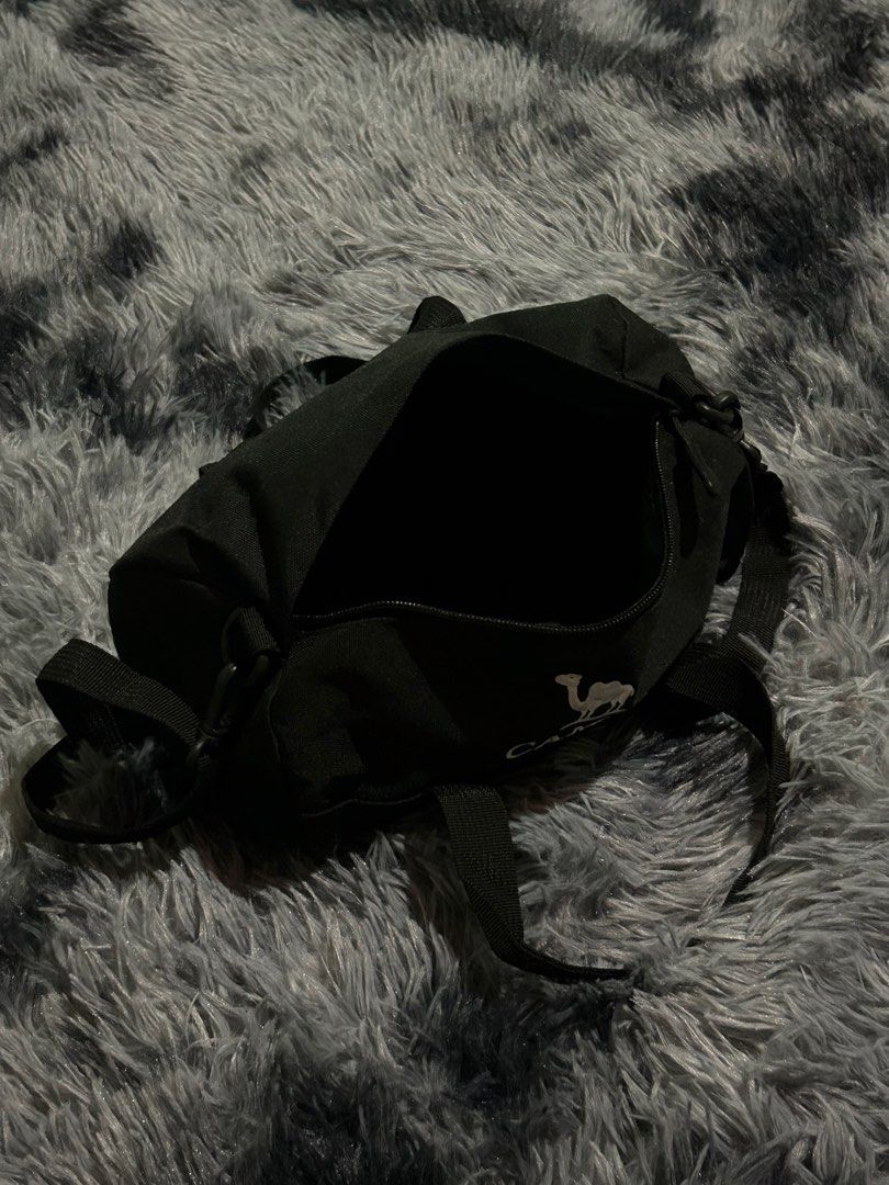 Black Camel Duffel Bag with Strap W11 L7 (Category: Sling Bags) located in Cadiz. Submitted by jaybatiller (Listing ID 1463256472, Image 3). Description: - Brand: Camel - Color: Black - Type: Duffel Bag - Features: Spacious main compartment, durable fabric - Carrying Options: Shoulder strap and two handles - Ideal for: Gym, short trips - Benefit: Easy to carry.