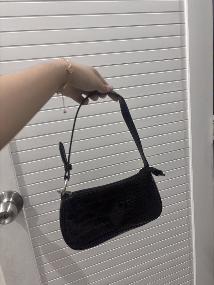 Black Croc Embossed Shoulder Bag with Ring Detail (Category: Shoulder Bags) located in Manila. Submitted by xoxo_tine (Listing ID 1463239969, Image 3). Description: - Cute black shoulder bag - Croc embossed texture - Silver ring detail on strap - Small size, ideal for essentials - Easy to carry.