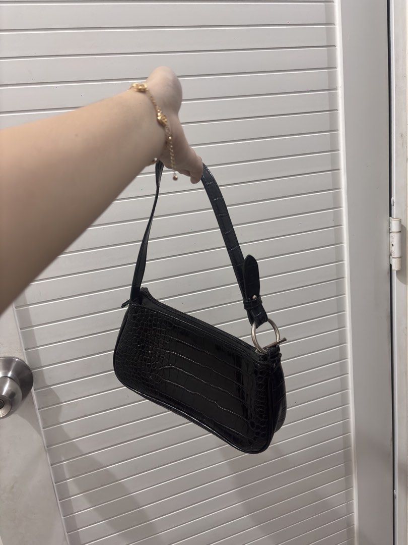 Black Croc Embossed Shoulder Bag with Ring Detail (Category: Shoulder Bags) located in Manila. Submitted by xoxo_tine (Listing ID 1463239969, Image 2). Description: - Cute black shoulder bag - Croc embossed texture - Silver ring detail on strap - Small size, ideal for essentials - Easy to carry.