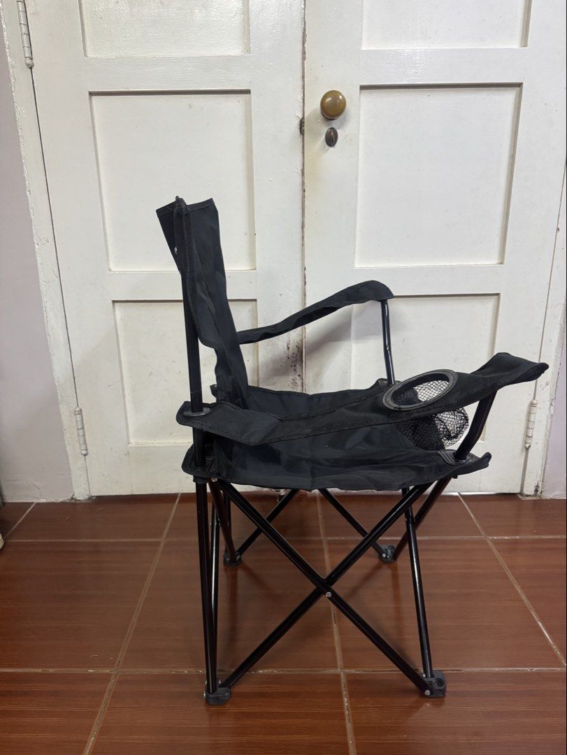 Black Folding Camping Chair with Cup Holder (Category: Chairs) located in Cavite. Submitted by lovegreenph (Listing ID 1463121283, Image 2). Description: - Sturdy black folding chair - Ideal for camping, picnics, and outdoor events - Built-in cup holder on the side - Folds compactly for easy storage and transport - Durable metal frame - Comfortable fabric seat and back.