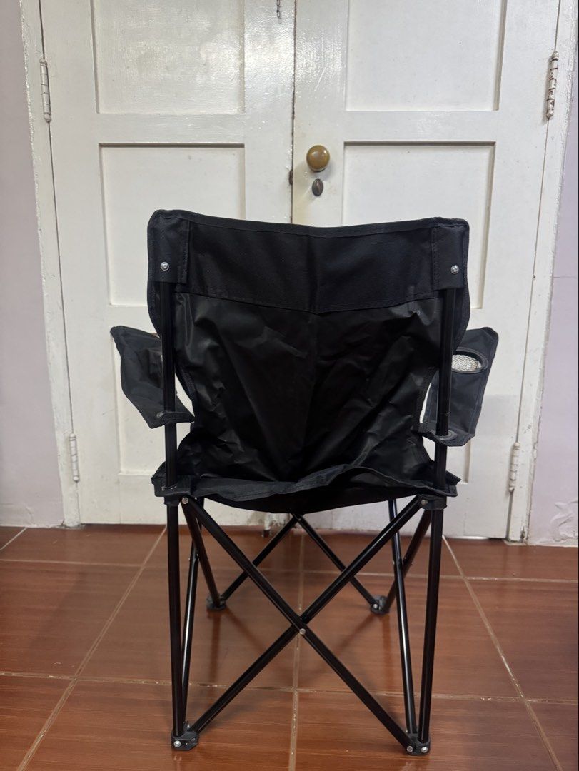 Black Folding Camping Chair with Cup Holder (Category: Chairs) located in Cavite. Submitted by lovegreenph (Listing ID 1463121283, Image 3). Description: - Sturdy black folding chair - Ideal for camping, picnics, and outdoor events - Built-in cup holder on the side - Folds compactly for easy storage and transport - Durable metal frame - Comfortable fabric seat and back.