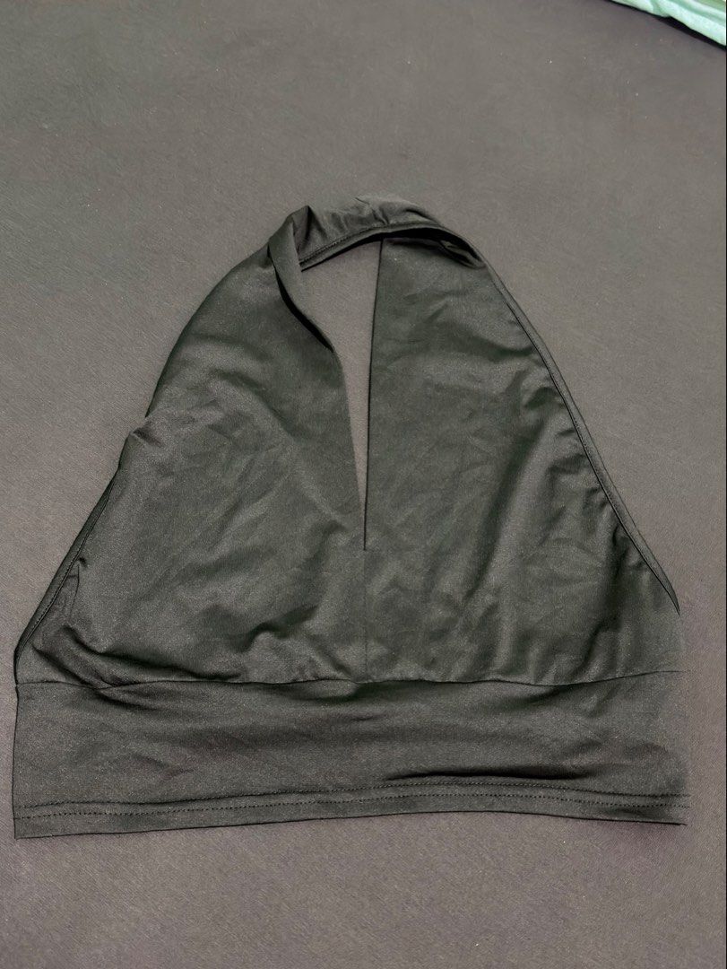 black halter crop top with a deep V-neckline (Category: Blouses) located in Manila. Submitted by _declutterprelovezz (Listing ID 1463264759, Image 1). Description: black halter crop top with a deep V-neckline M/L.