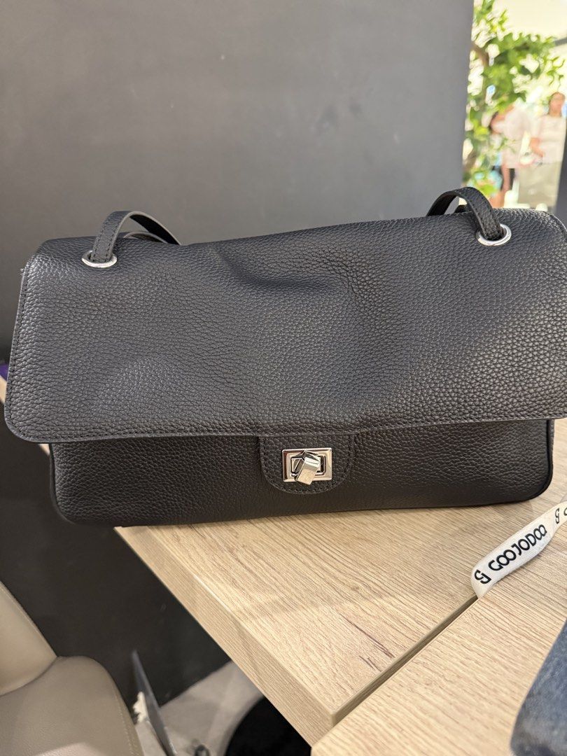 Black Leather Shoulder Bag with Silver Clasp (Category: Shoulder Bags) located in Makati City. Submitted by bns4acoz (Listing ID 1463270361, Image 1). Description: - Stylish black leather shoulder bag - Textured leather finish for a premium look - Secure silver clasp closure on the front flap - Long, adjustable strap for comfortable wear - C. Blazy inspired style - 36 cm base width - Genuine clemence leather - location QC - comes with dust bag, n