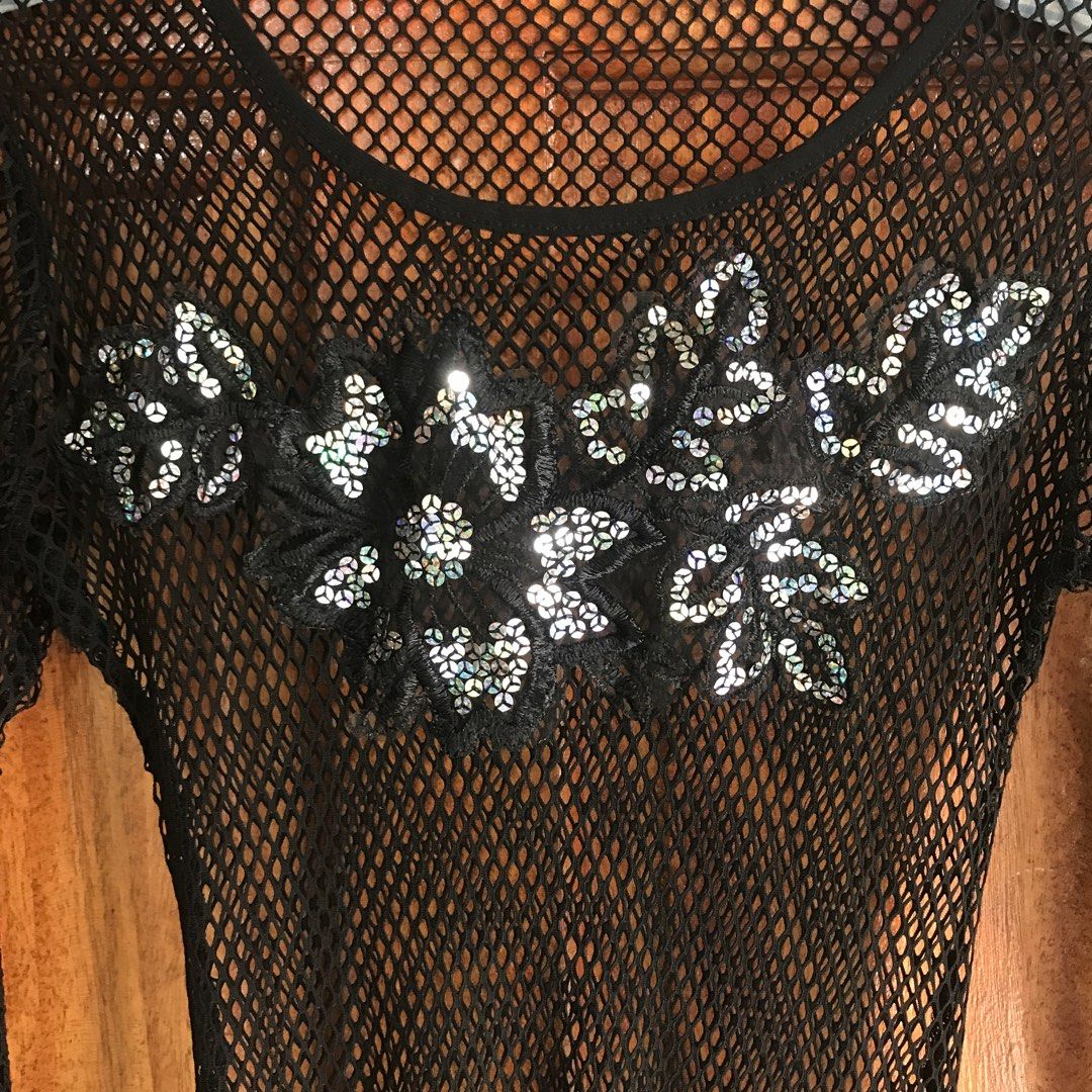 Black Mesh Long Sleeve Top with Sequins (Category: Longsleeves) located in Manila. Submitted by strawberrieaudr3y (Listing ID 1463276021, Image 2). Description: - Black fishnet long sleeve top - Floral applique with sequins on chest - Scalloped lace trim at hem and cuffs - Very stretchy material - Ideal for layering or a night out - Looks great over a bralette or camisole.