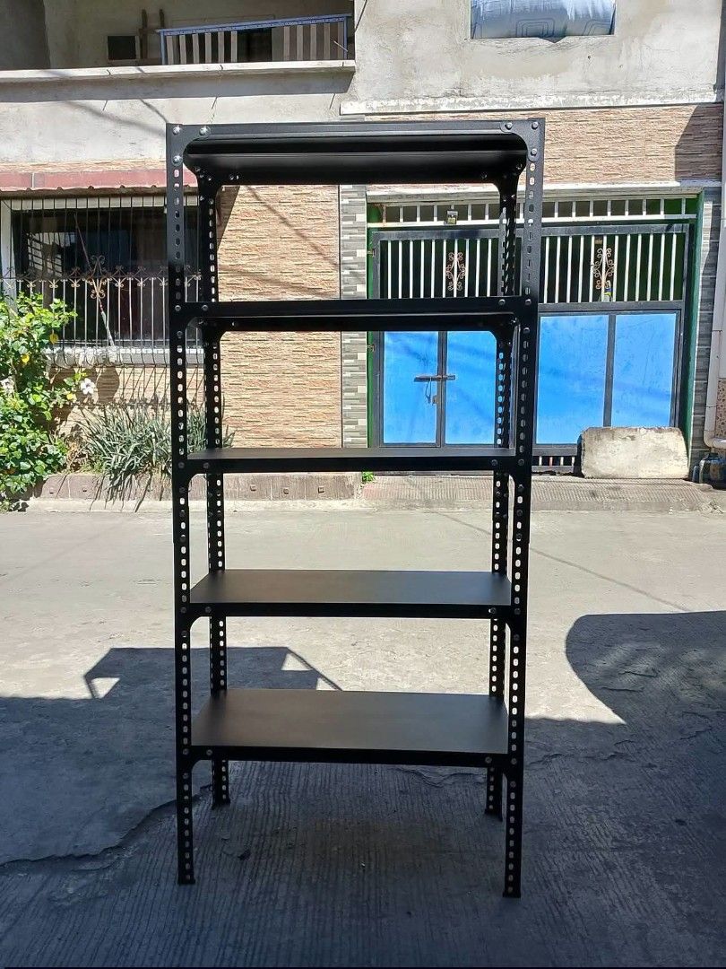 Black Metal 5-Tier Boltless Shelving Unit Storage Rack (Category: Shelves, Cabinets & Racks) located in Caloocan City. Submitted by swiftflower_802790 (Listing ID 1463159082, Image 1). Description: - Heavy duty black metal shelving unit - 5 tiers for ample storage - Boltless design for easy assembly - Ideal for garage, workshop, or storage room organization - Sturdy and durable construction - Approximate dimensions: [height] tall, [width] wide, [