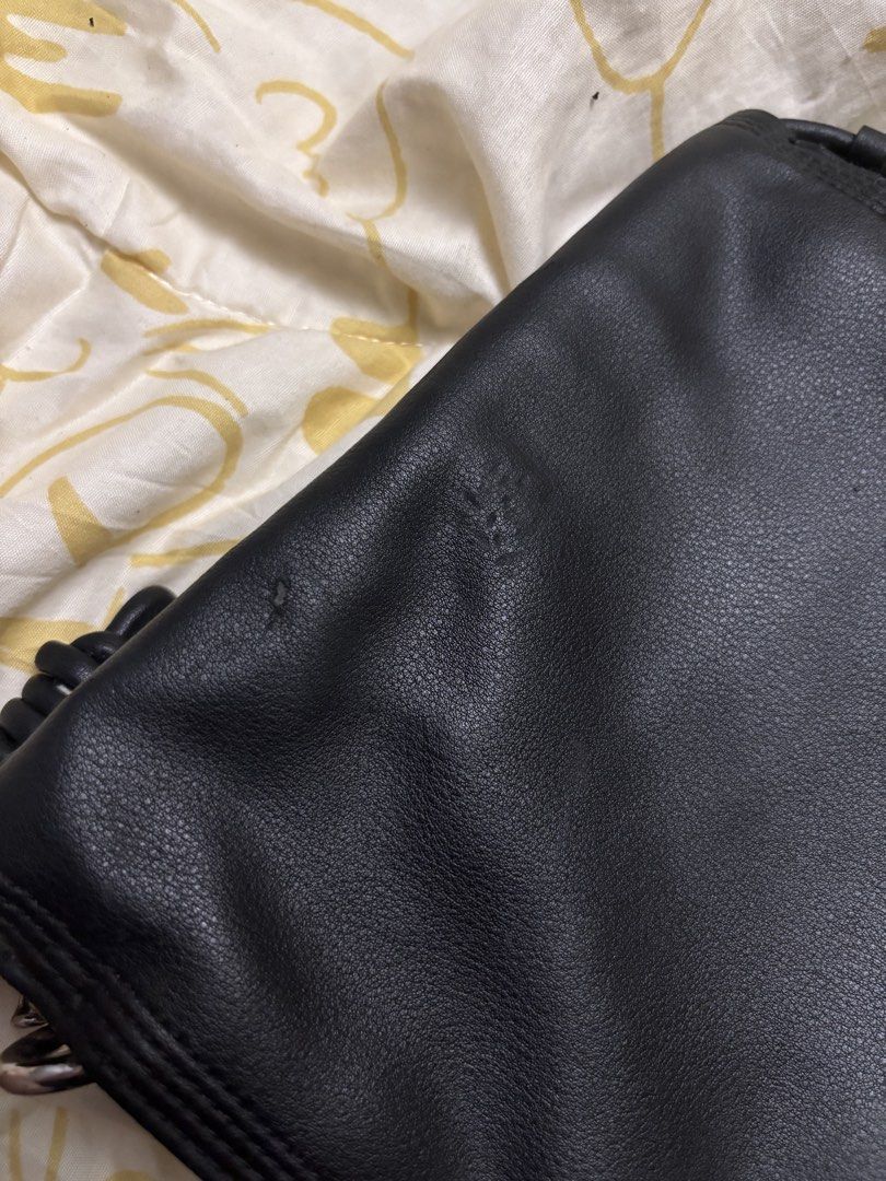 black mini bag (Category: Purses & Pouches) located in Taguig. Submitted by megdeclutterz (Listing ID 1463256248, Image 3). Description: - small bag - not branded - with strap - approx. 6x6 inches - no zippers - few scratches ‼️ negotiable ‼️ please manage your expectations ‼️ Taguig/Bgc location.