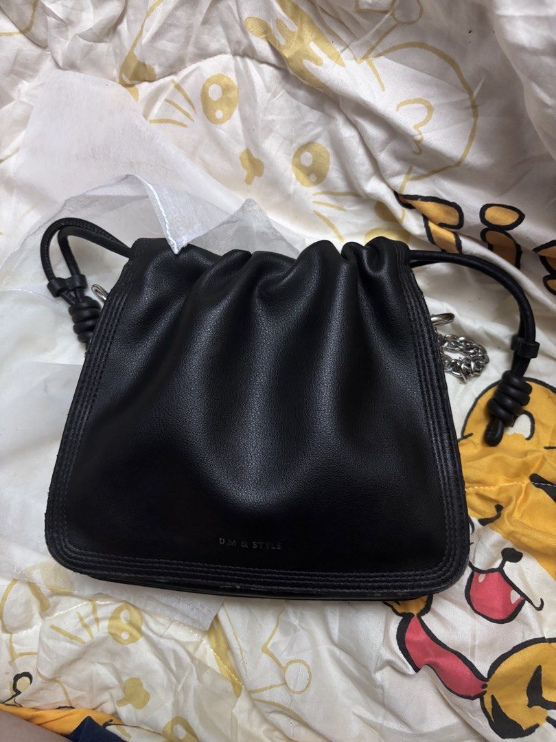 black mini bag (Category: Purses & Pouches) located in Taguig. Submitted by megdeclutterz (Listing ID 1463256248, Image 1). Description: - small bag - not branded - with strap - approx. 6x6 inches - no zippers - few scratches ‼️ negotiable ‼️ please manage your expectations ‼️ Taguig/Bgc location.