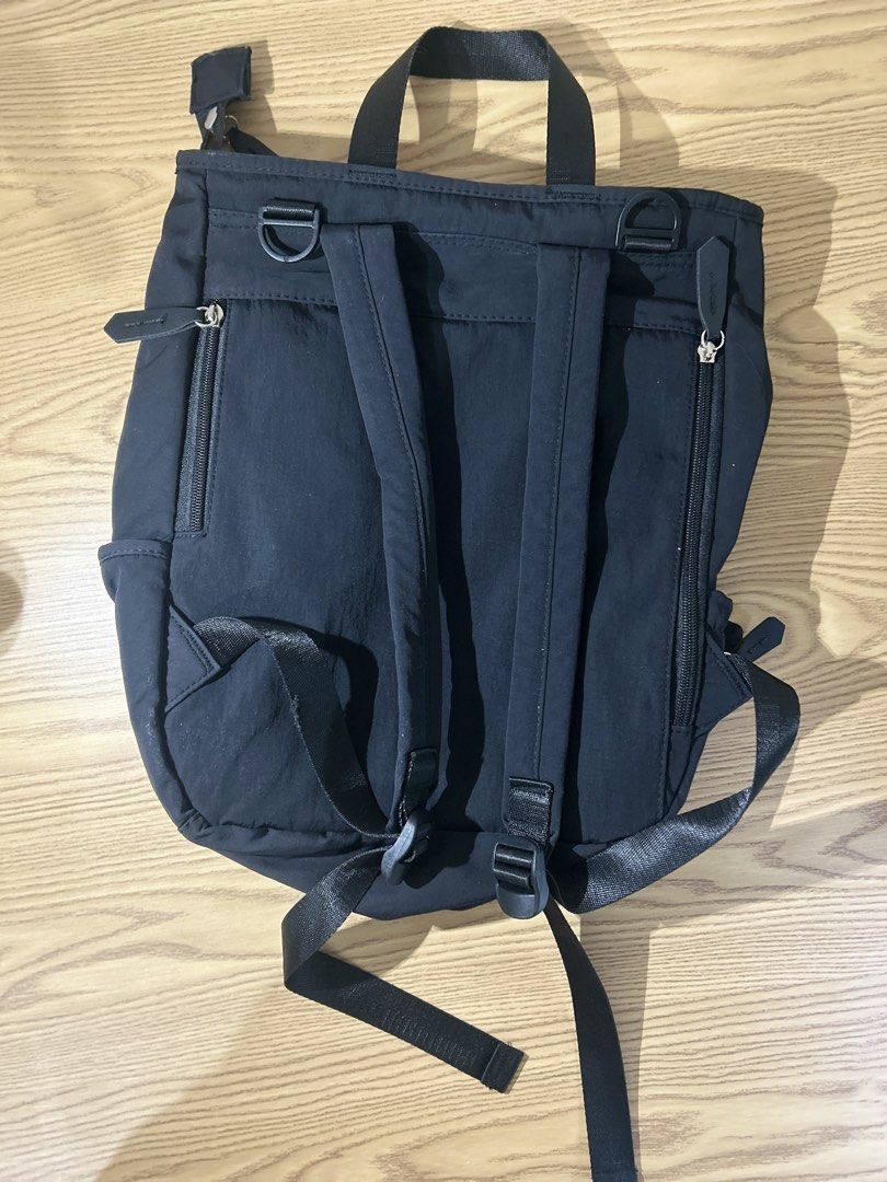 Black Nylon Backpack with Multiple Pockets (Category: Backpacks) located in Manila. Submitted by zealpenguin-a0aa (Listing ID 1463119183, Image 2). Description: - Durable black nylon backpack - Comfortable top handles and adjustable shoulder straps - Secure main compartment with zip closure - Convenient front pocket with zip - Handy side pockets for extra storage - Ideal for everyday errands or travel adventures - Spacious interior to fit all you
