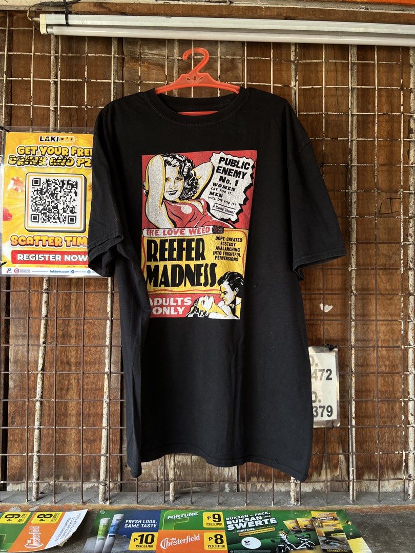Black Reefer Madness T-shirt (Category: Tshirts & Polo Shirts ) located in Manila. Submitted by re-connectph888 (Listing ID 1463143347, Image 1). Description: - Black t-shirt - 'Reefer Madness' graphic print - Vintage movie poster style design - Bold text and illustrations - 'Adults Only' printed on front - Classic propaganda style graphic - Great conversation starter.