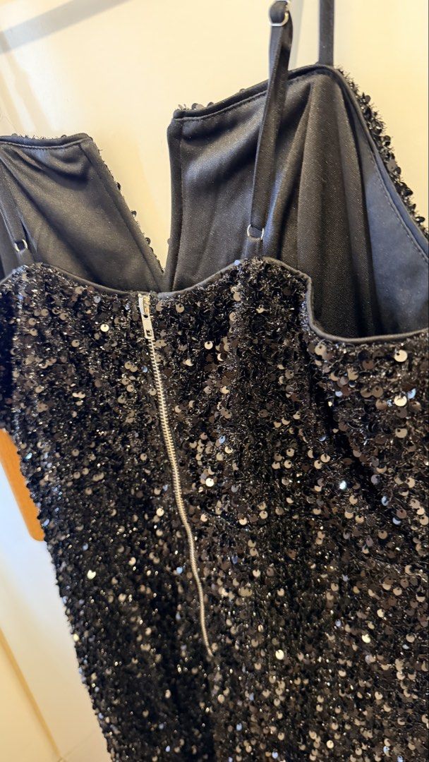 Black Sequin V-Neck Mini Dress with Zipper Back (Category: Dresses) located in Pasay City. Submitted by thriftyfinds90 (Listing ID 1463134755, Image 3). Description: - Sparkly black sequin mini dress - Flattering V-neckline - Adjustable spaghetti straps for a perfect fit - Secure back zipper closure - Comfortable lining for all-night wear - Ideal for parties, nights out, or your next special event ✨ Mostly new/almost new or worn 1–2x. Most fit XL