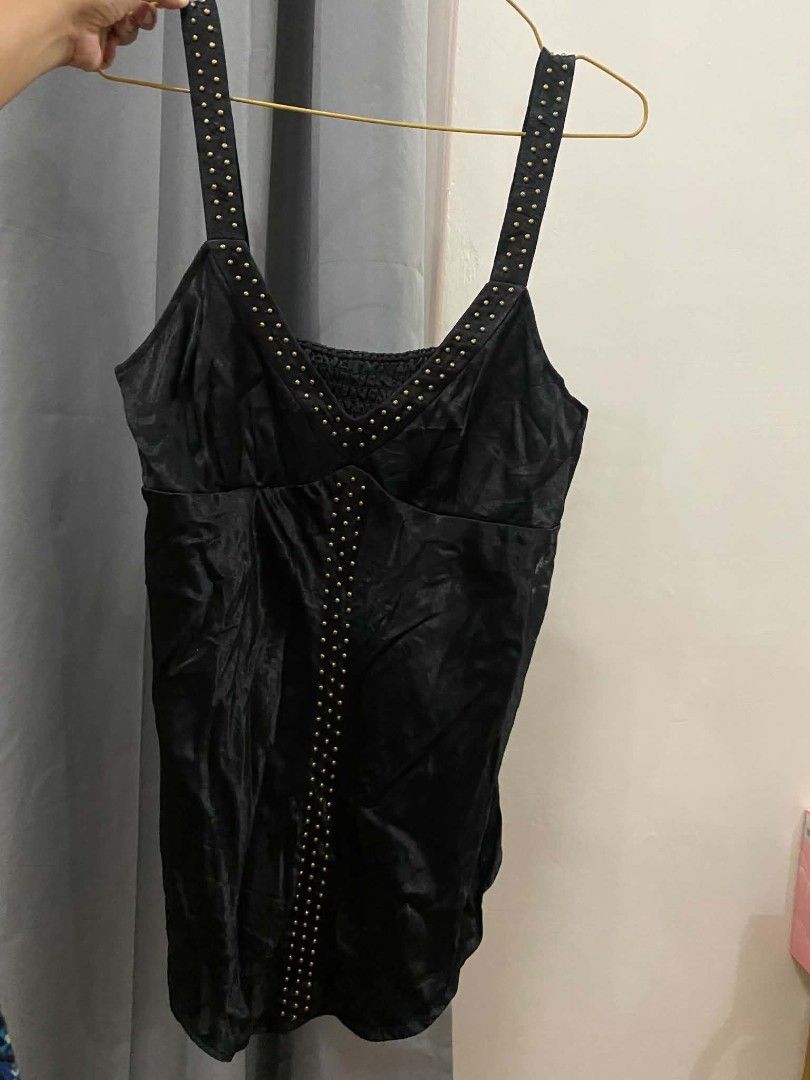 Black Studded Smocked Bodysuit Tank Top (Category: Sleeveless) located in Malasiqui. Submitted by finnley26 (Listing ID 1463165764, Image 1). Description: - Shiny black fabric - Smocked chest detail - Tank top style - Straps with gold stud accents - Versatile for layering or wearing alone SMALL TO MED.