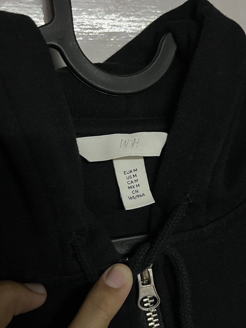 Black Zip Up Hoodie | H&M (Category: Hoodies) located in Paranaque City. Submitted by hearty444 (Listing ID 1463303293, Image 2). Description: ⋆˚꩜｡ - size medium - length: 22in - width: 21in - sleeves: 22in rfs: declutterring DM me!.